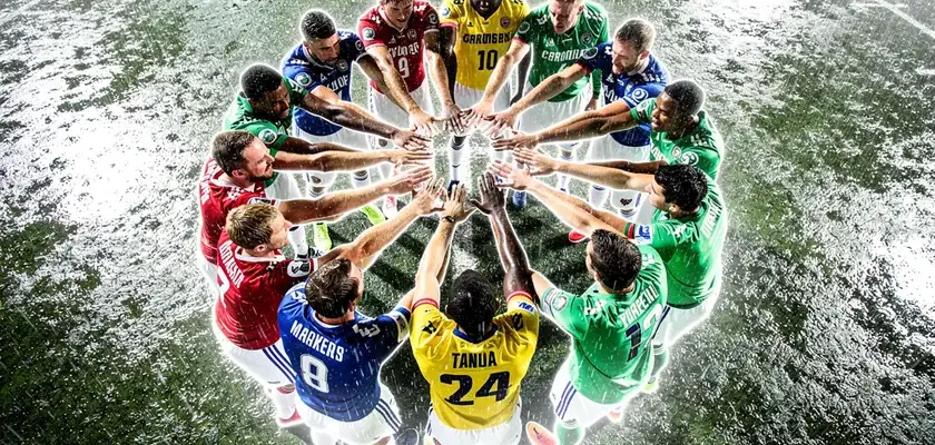 Colorado Rockies players warming up at Coors Field before the 2026 Opening Day roster announcement